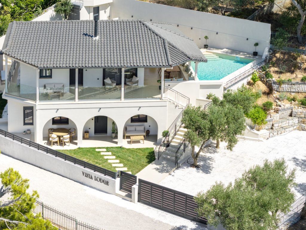 Aerial view of a luxury villa with private swimming pool in Athens Riviera